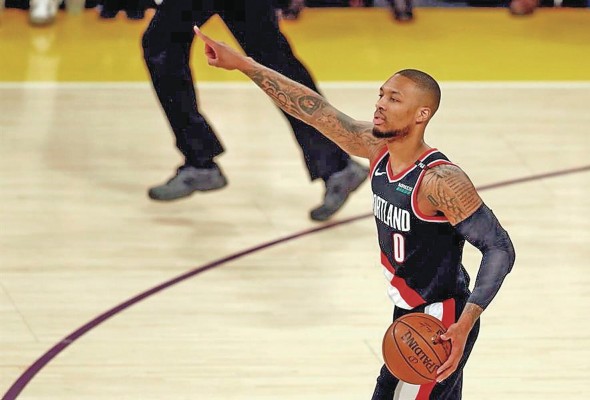 Damian Lillard de Portland Trail Blazers en acción. Damian Lillard de Portland Trail Blazers en acción.
