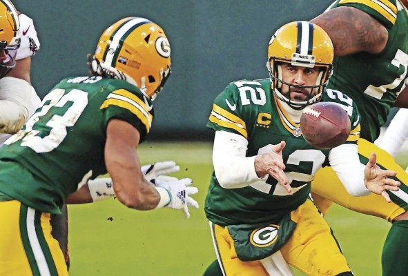 Aaron Rodgers (d), mariscal de campo de los Green Bay Packers Aaron Rodgers (d), mariscal de campo de los Green Bay Packers