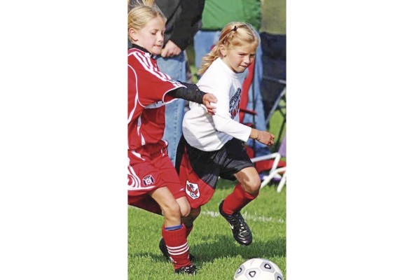 Riley disputando un partido en una liga infantil de Grand Rapids, Michigan, Estados Unidos. Riley disputando un partido en una liga infantil de Grand Rapids, Michigan, Estados Unidos.