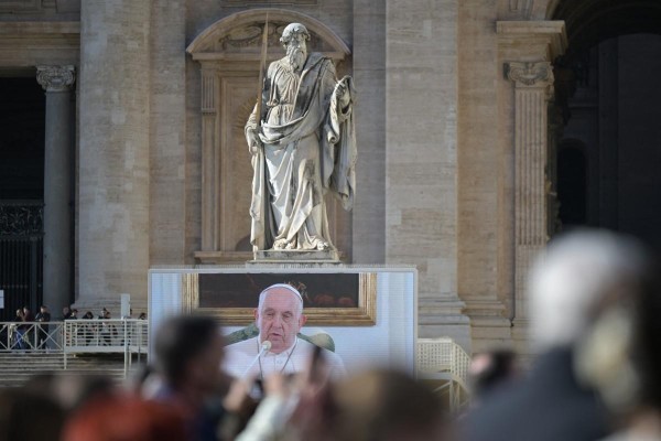 Pope Francis is seen on a giant screen at St. Peter's square in The Vatican as he delivers the Angelus prayer on December 3, 2023. - Pope Francis's health is improving, the Vatican said yesterday, after the pontiff was forced to cancel his attendance at the COP28 climate conference because of bronchitis. Even so, to avoid exposing him to temperature variations, the 86-year-old Argentinian recited the traditional Angelus Prayer from his private quarters. (Photo by Tiziana FABI / AFP) Pope Francis is seen on a giant screen at St. Peter's square in The Vatican as he delivers the Angelus prayer on December 3, 2023. - Pope Francis's health is improving, the Vatican said yesterday, after the pontiff was forced to cancel his attendance at the COP28 climate conference because of bronchitis. Even so, to avoid exposing him to temperature variations, the 86-year-old Argentinian recited the traditional Angelus Prayer from his private quarters. (Photo by Tiziana FABI / AFP)