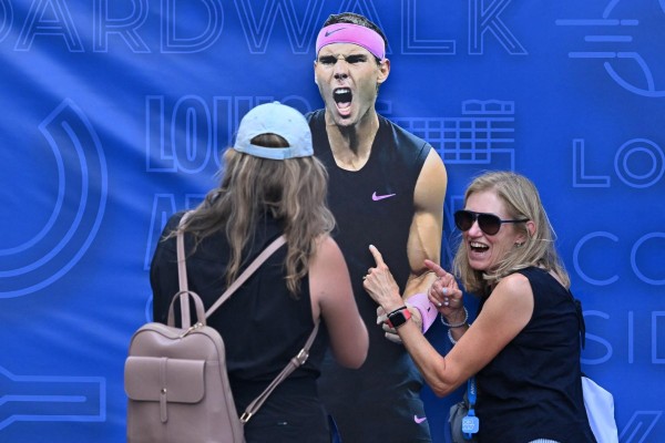 Tennis fans pose with a cutout of Rafael Nadal during the US Open tennis tournament in New York on August 30, 2023. (Photo by Ed JONES / AFP) Tennis fans pose with a cutout of Rafael Nadal during the US Open tennis tournament in New York on August 30, 2023. (Photo by Ed JONES / AFP)