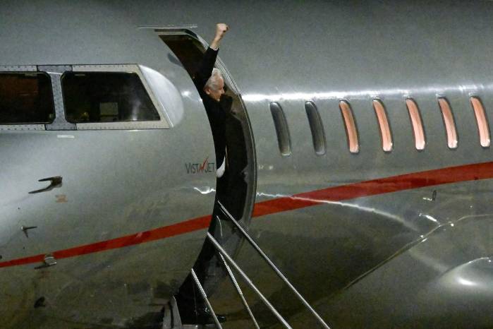 WikiLeaks founder Julian Assange raises his fist from the door of the plane after arriving at Canberra Airport in Canberra on June 26, 2024, after he pleaded guilty at a US court in Saipan to a single count of conspiracy to obtain and disseminate US national defence information. - WikiLeaks founder Julian Assange returned home to Australia to start life as a free man June 26 after admitting he revealed US defence secrets in a deal that unlocked the door to his London prison cell. WikiLeaks founder Julian Assange raises his fist from the door of the plane after arriving at Canberra Airport in Canberra on June 26, 2024, after he pleaded guilty at a US court in Saipan to a single count of conspiracy to obtain and disseminate US national defence information. - WikiLeaks founder Julian Assange returned home to Australia to start life as a free man June 26 after admitting he revealed US defence secrets in a deal that unlocked the door to his London prison cell.