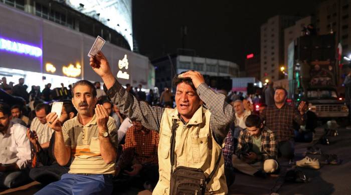 Iranians pray for President Ebrahim Raisi and Foreign Minister Hossein Amir-Abdollahian in Valiasr Square in central Tehran on May 19, 2024. - A helicopter in the convoy Raisi and Amir-Abdollahian was involved in an accident in East Azerbaijan. Iranians pray for President Ebrahim Raisi and Foreign Minister Hossein Amir-Abdollahian in Valiasr Square in central Tehran on May 19, 2024. - A helicopter in the convoy Raisi and Amir-Abdollahian was involved in an accident in East Azerbaijan.