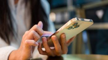 Woman use of mobile phone in cafe