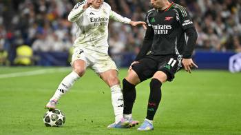 El equipo del Real Madrid durante el calentamiento previo al juego ante el Arsenal.