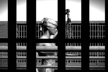 Prison bars and a hallway