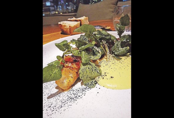 Pulpo con salsa anticuchera y berros