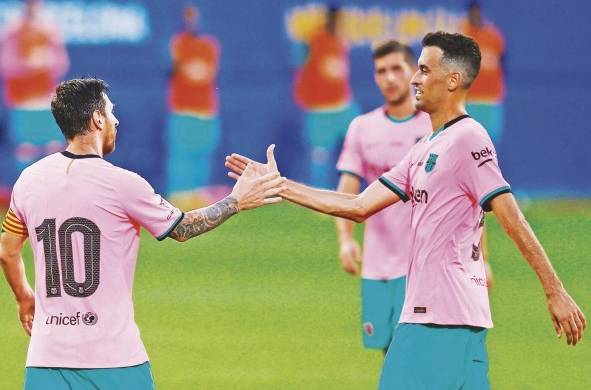 Lionel Messi y Sergio Busquets durante su etapa en el FC Barcelona