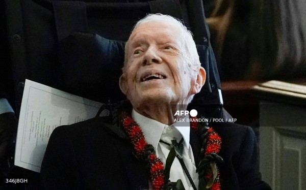 Former President Jimmy Carter departs after the funeral service for former first lady Rosalynn Carter at Maranatha Baptist Church, in Plains, Georgia, on November 29, 2023. - Carter died on November 19, 2023, at the age of 96, just two days after joining her husband in hospice care at their house in Plains. (Photo by Alex Brandon / POOL / AFP)