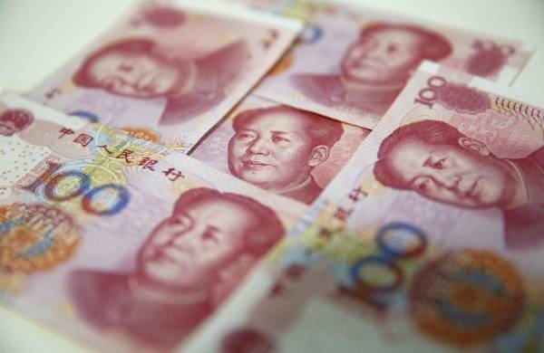 Varios billetes de 100 yuanes en Pekín, en una fotografía de archivo.