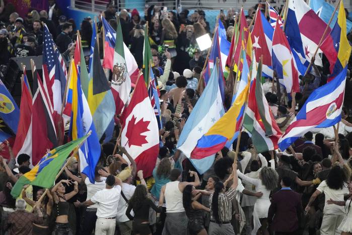 SANTA CLARA, CALIFORNIA - FEBRUARY 08: Participants partake in the performance onstage during the Apple Music Super Bowl LX Halftime Show at Levi's Stadium on February 08, 2026 in Santa Clara, California. Thearon W. Henderson/Getty Images/AFP (Photo by Thearon W. Henderson / GETTY IMAGES NORTH AMERICA / Getty Images via AFP)