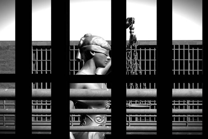 Prison bars and a hallway